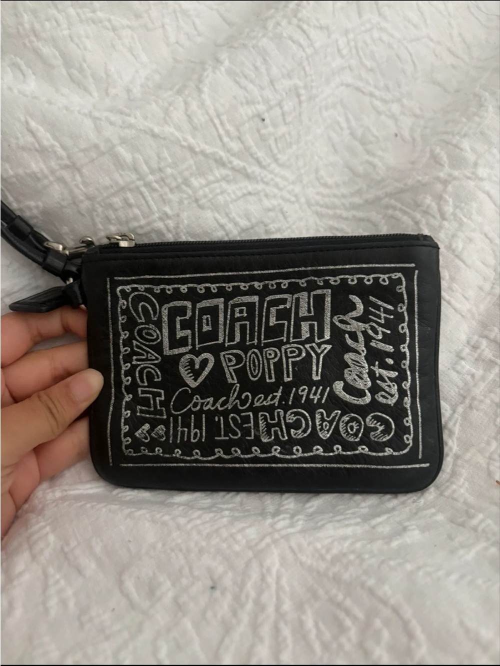 Coach Black Wristlet with White Chalk Script Poppy Design